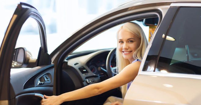 Young lady in a new car