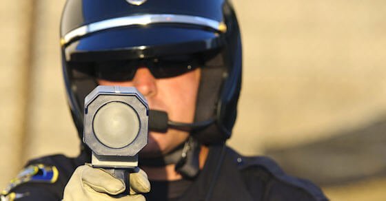 Police officer with a radar gun